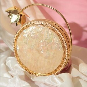 Elegant Gold and Cream Round Clutch